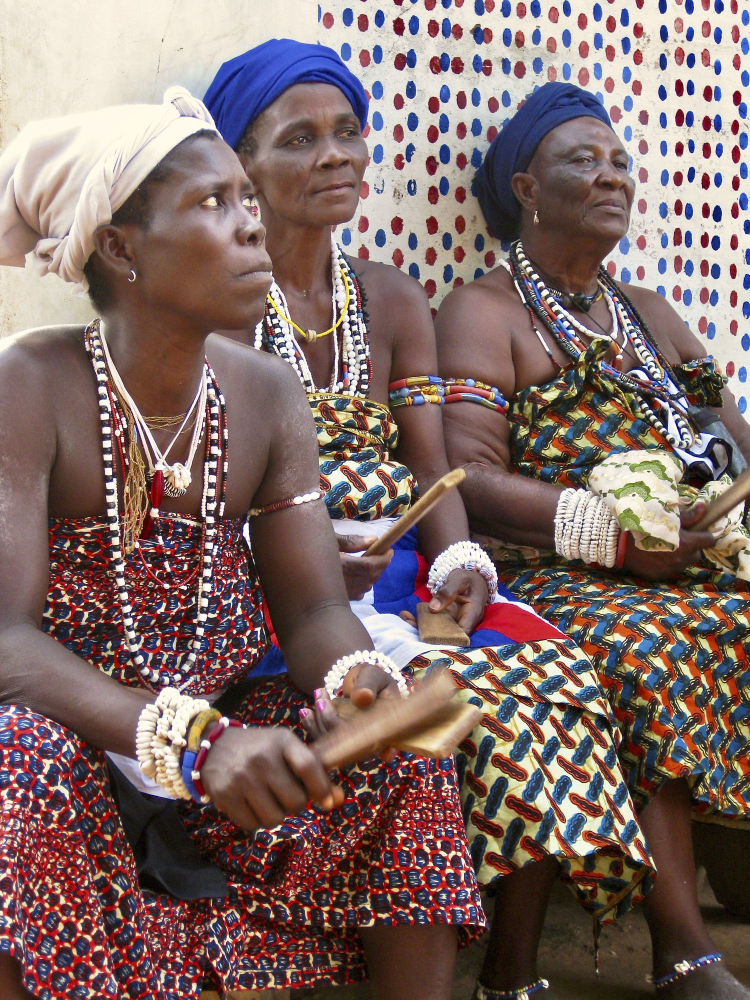Three women with clapping sticks