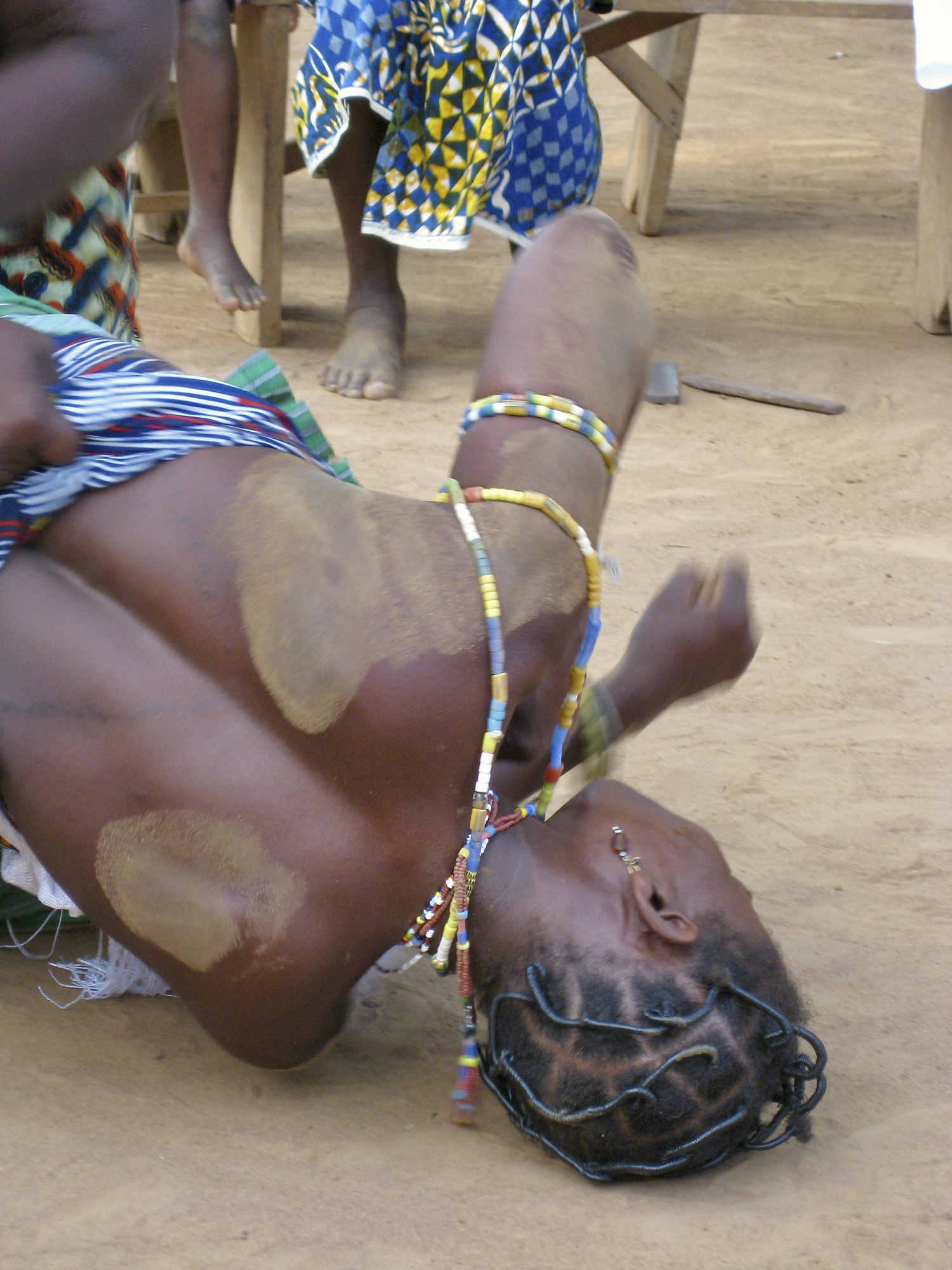 Woman being "possessed" on the ground