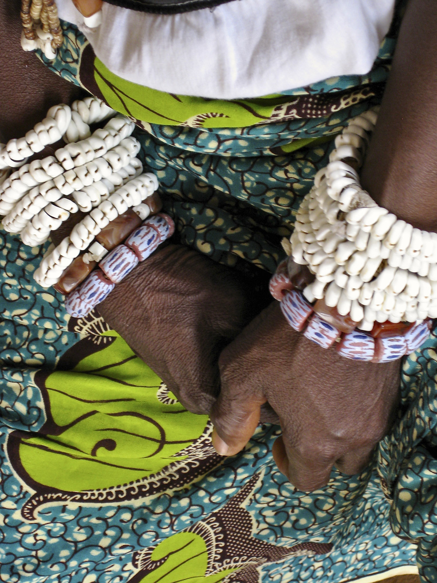 Womans hands folded in her lap 