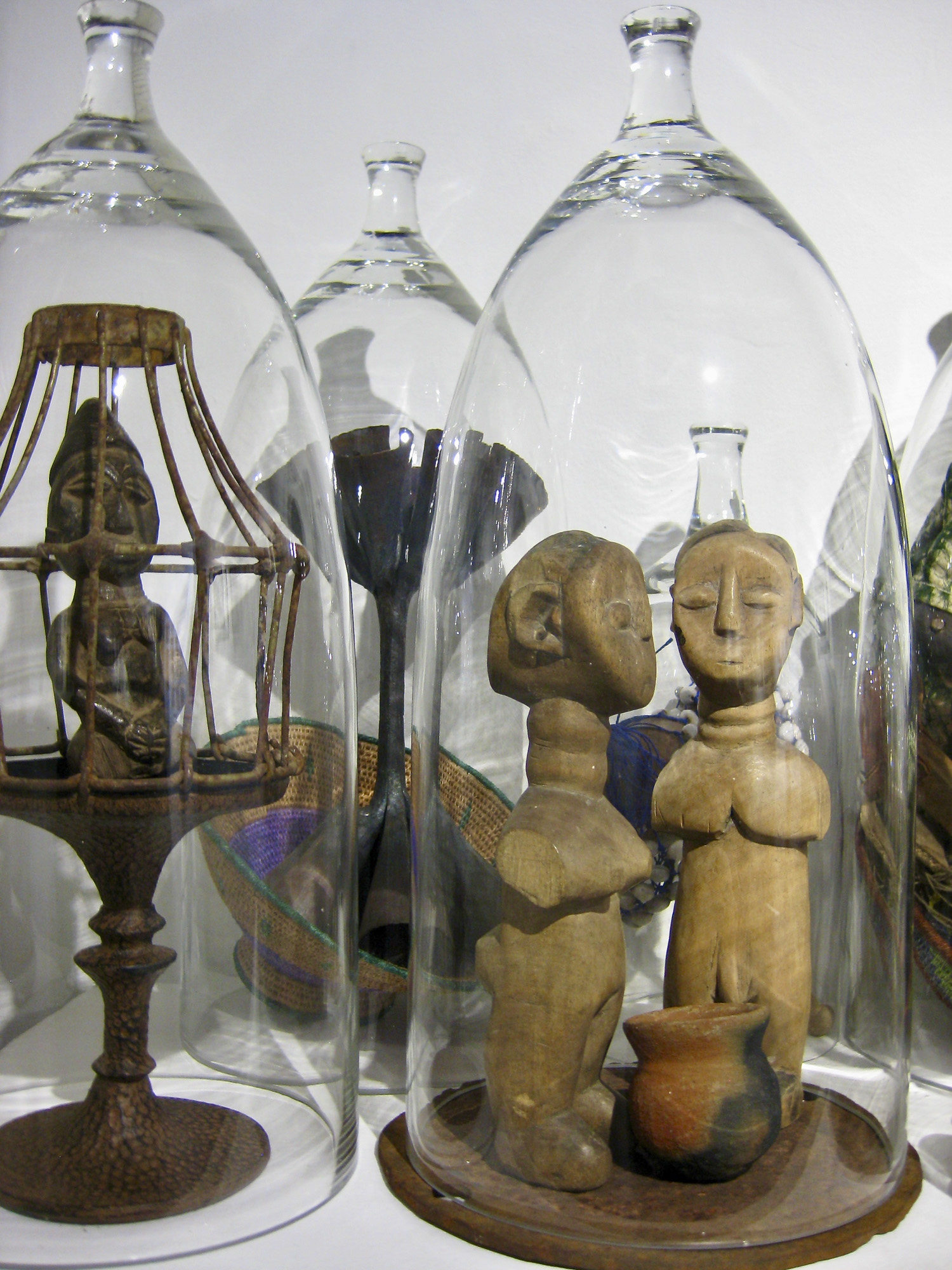 Figures under glass cloche 