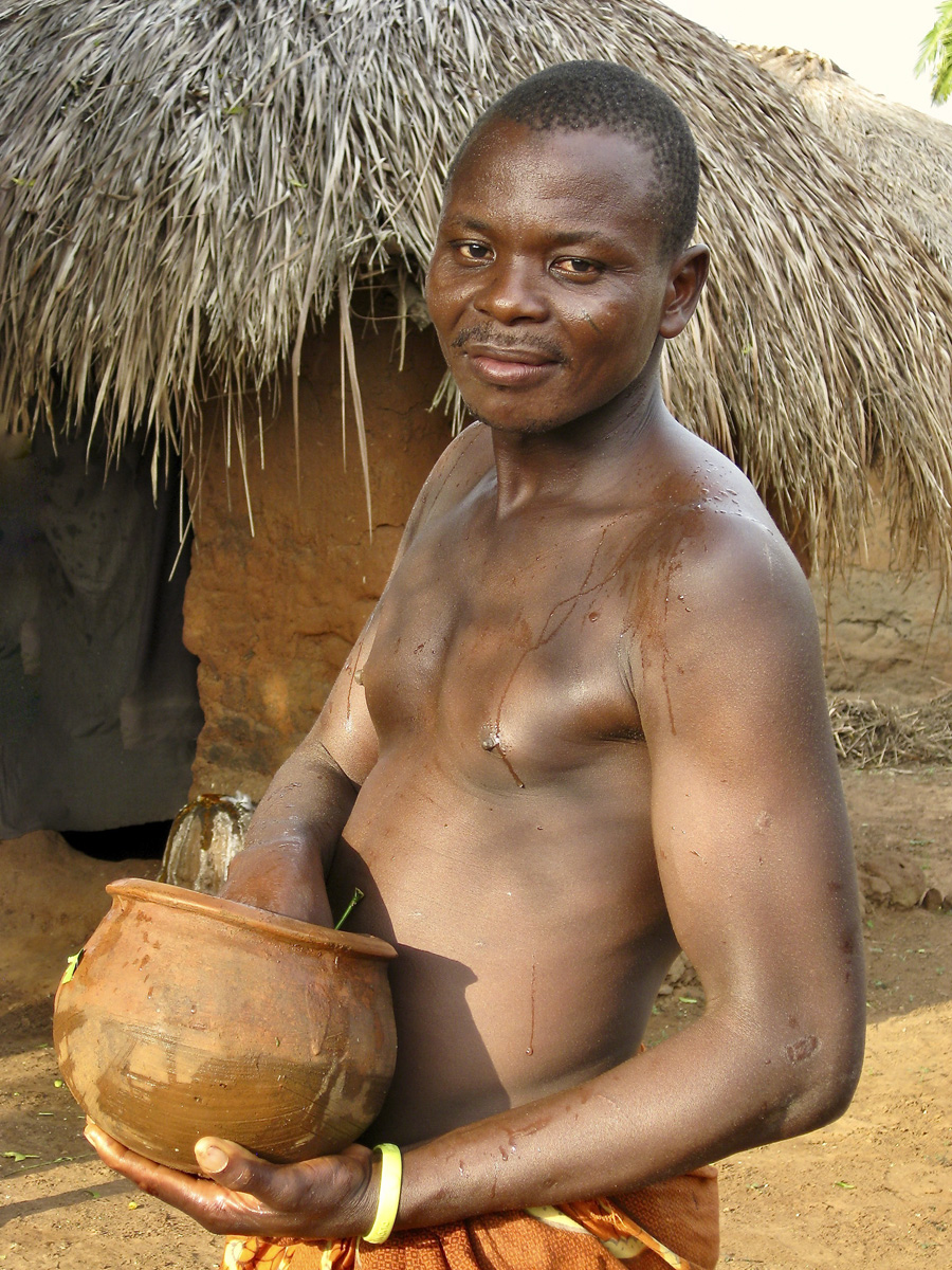 Man holding a clay pot