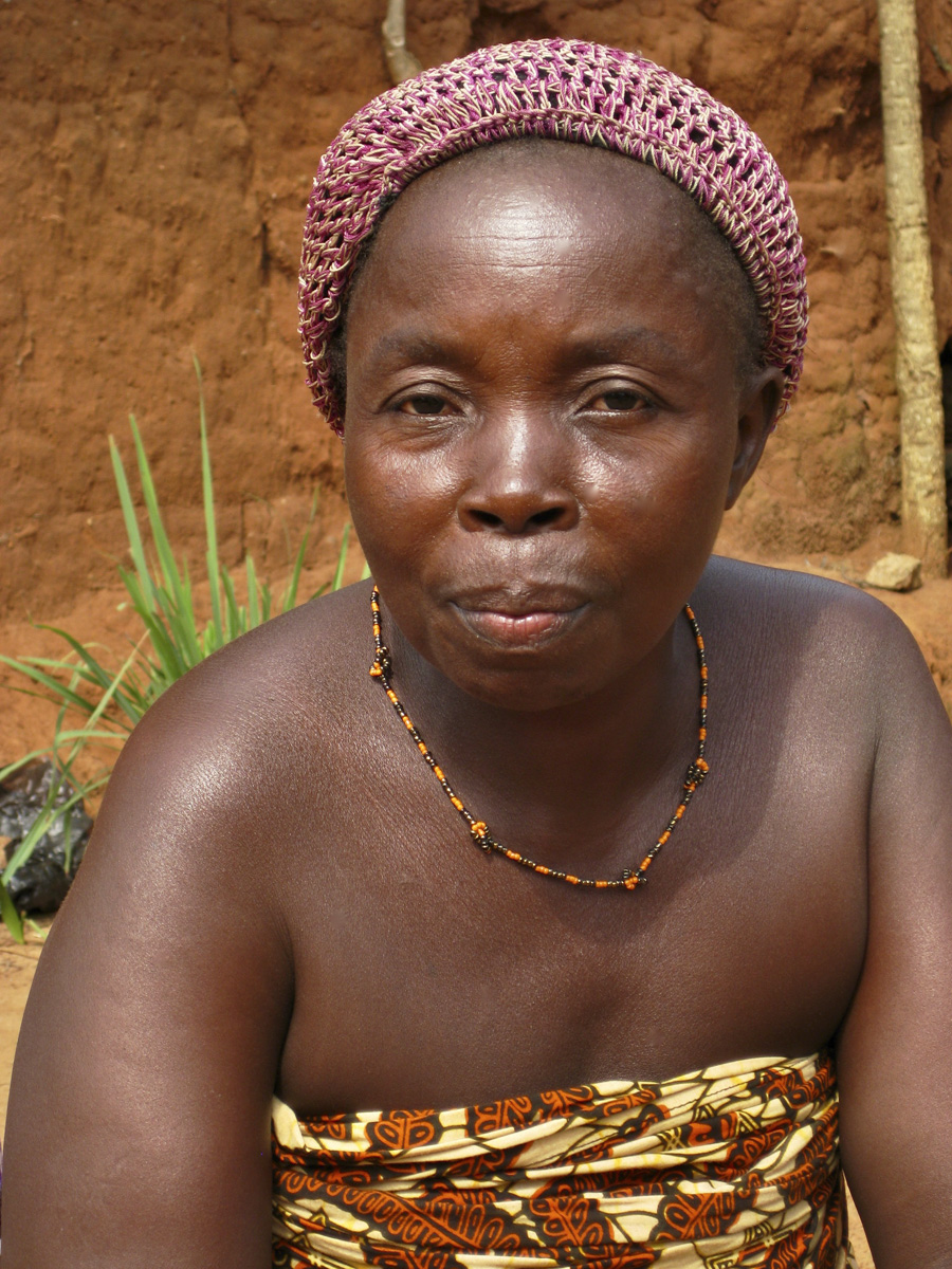 African woman in red and gold dress, close up