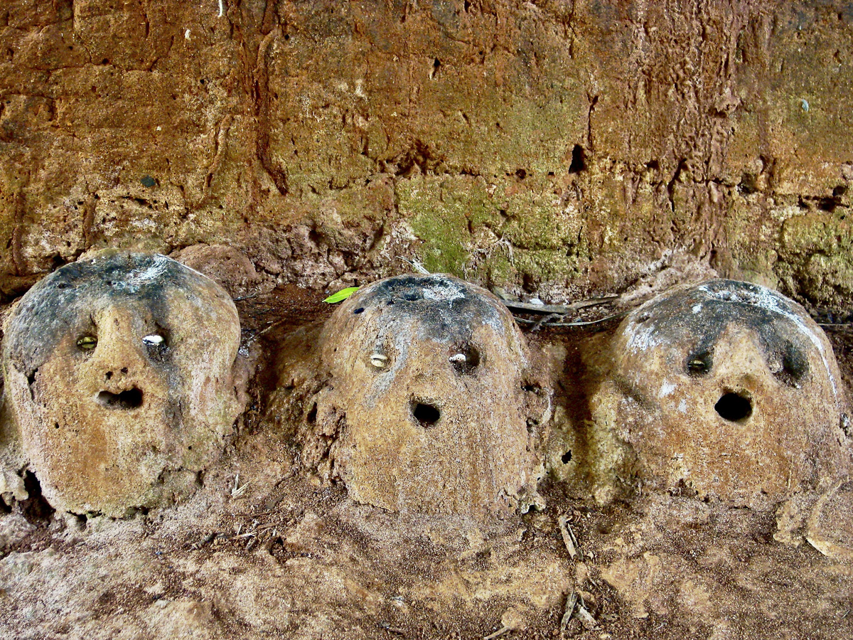 three clay mound figures