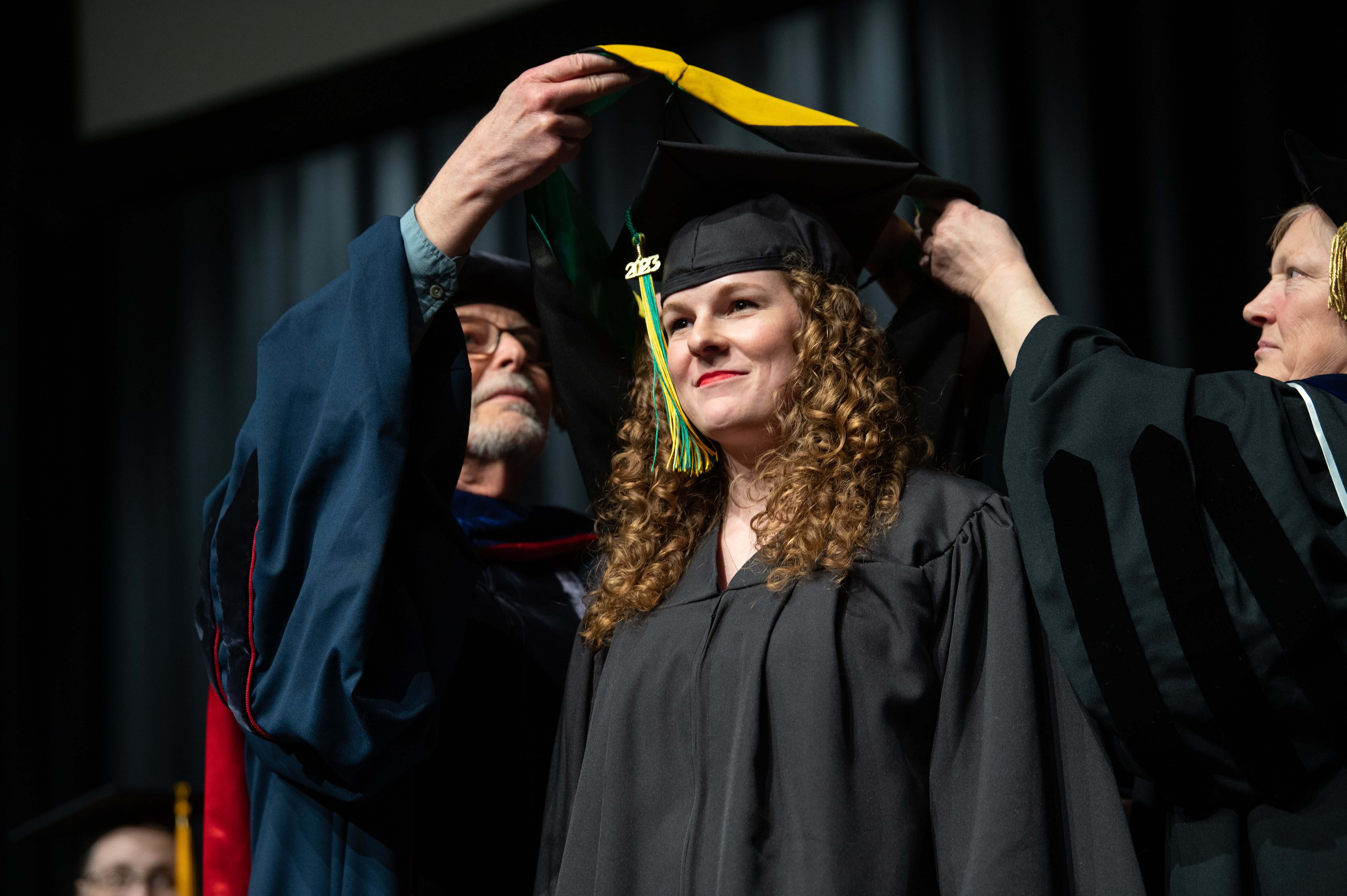 Graduate receiving their hood