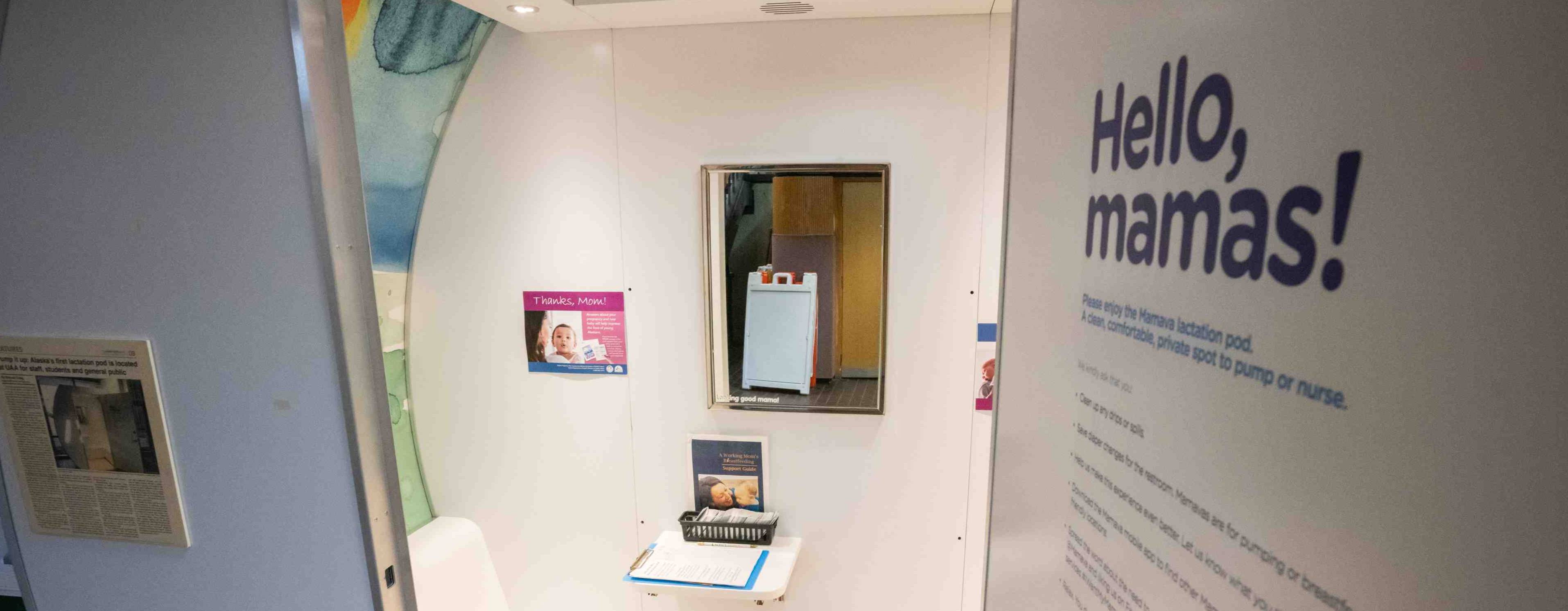 Lactation pod with the words, "Hello, mamas!" on the door
