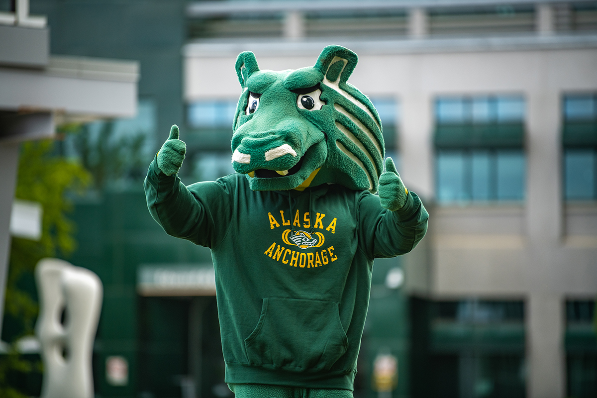 Spirit the Seawolf giving a thumbs up while on campus.